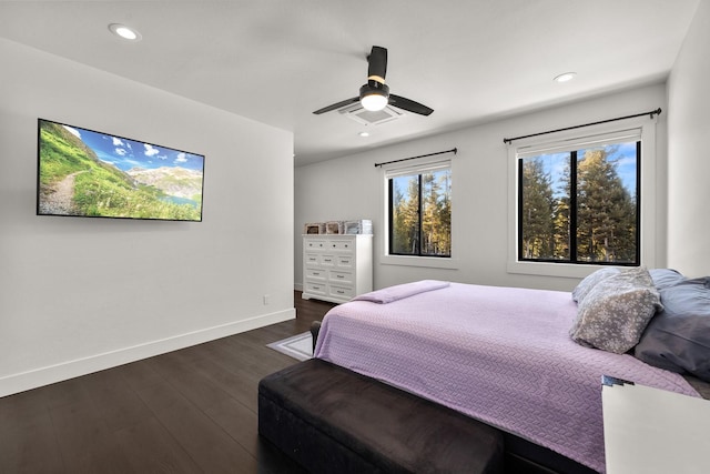 bedroom featuring ceiling fan, recessed lighting, visible vents, baseboards, and dark wood finished floors