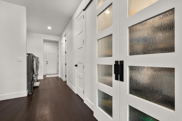 hall with dark wood-type flooring, recessed lighting, and baseboards