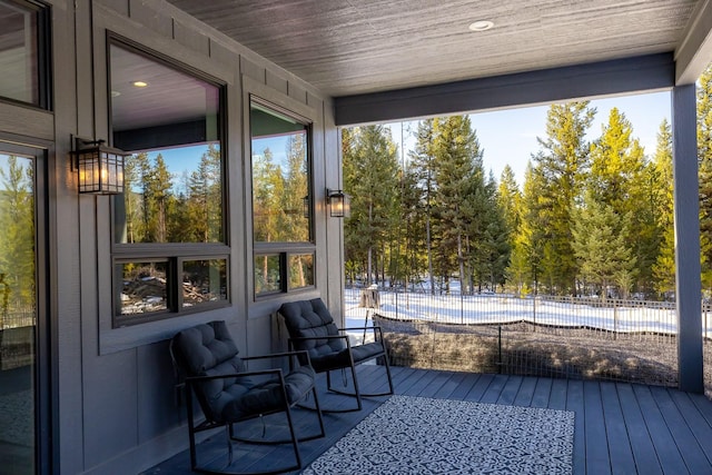 sunroom featuring wooden ceiling