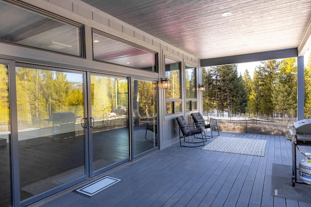 exterior space featuring a healthy amount of sunlight and wood ceiling