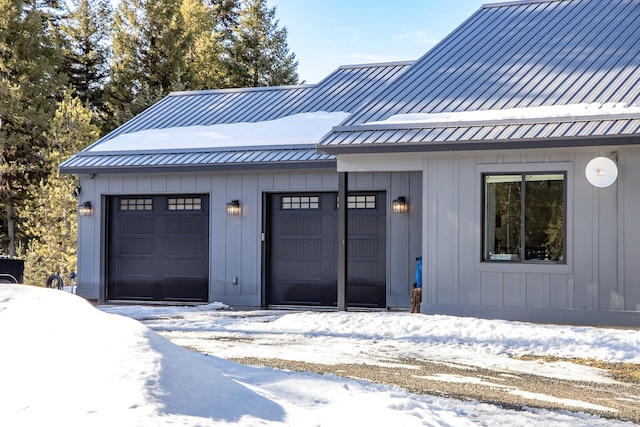 view of snow covered garage