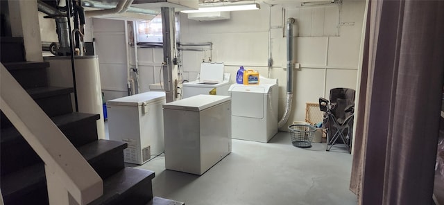 clothes washing area with washing machine and dryer and laundry area