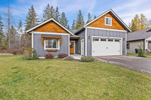230 Forest Edge Trl, Kalispell, MT 59901 - living room featuring stairs, lofted ceiling, a fireplace, a ceiling fan, and dark wood finished floors