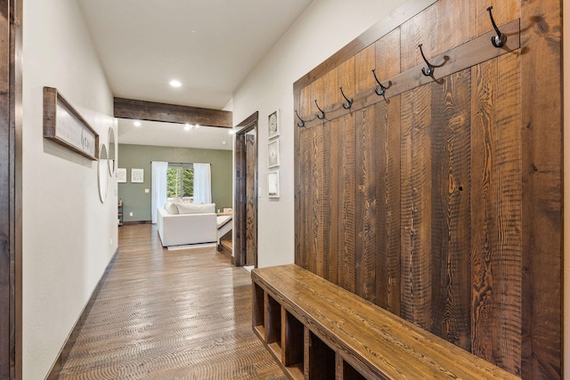 mudroom featuring baseboards and wood finished floors