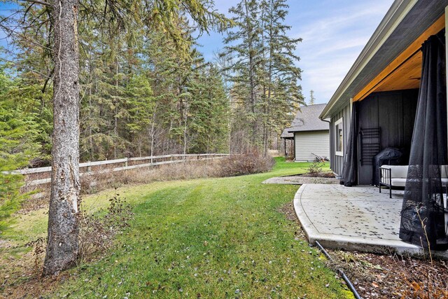 230 Forest Edge Trl, Kalispell, MT 59901 - view of yard with a storage shed, an outdoor structure, and a fenced backyard