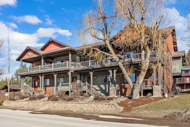 view of front of house featuring covered porch and a balcony