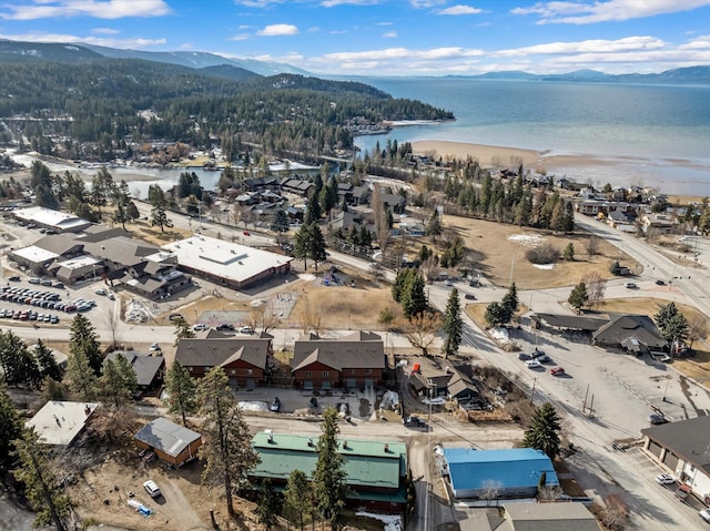 aerial view featuring a water and mountain view