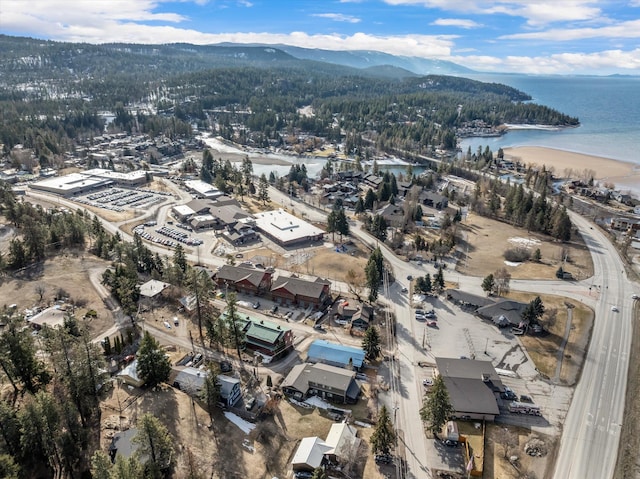 bird's eye view with a water and mountain view