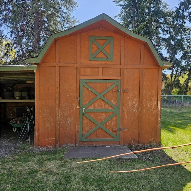 view of shed with fence