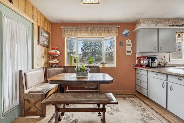 dining space with wooden walls