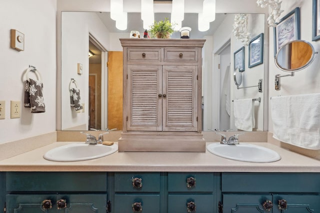 full bath featuring double vanity and a sink