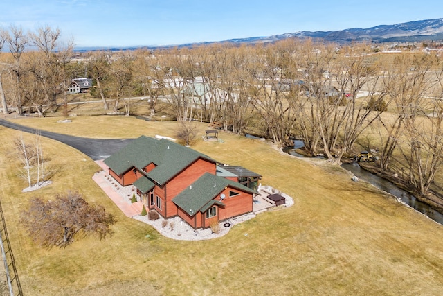 birds eye view of property with a mountain view