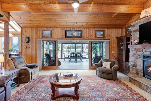 297 Christofferson Ln, Corvallis, MT 59828 - living room featuring vaulted ceiling, healthy amount of natural light, a stone fireplace, wood ceiling, and wood walls