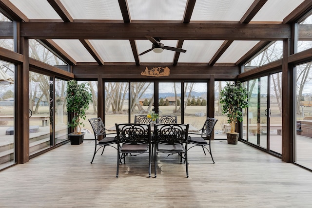 297 Christofferson Ln, Corvallis, MT 59828 - sunroom / solarium featuring plenty of natural light, wood finished floors, a mountain view, and expansive windows