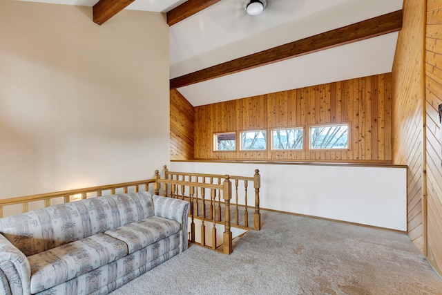 297 Christofferson Ln, Corvallis, MT 59828 - carpeted living area featuring beam ceiling and wood walls