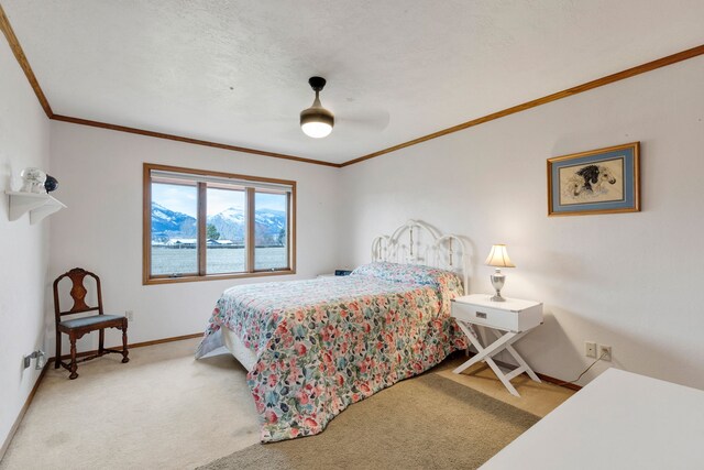 297 Christofferson Ln, Corvallis, MT 59828 - carpeted bedroom with crown molding, baseboards, and ceiling fan