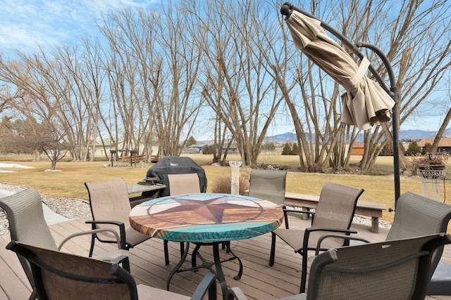 297 Christofferson Ln, Corvallis, MT 59828 - wooden deck featuring a lawn and a mountain view