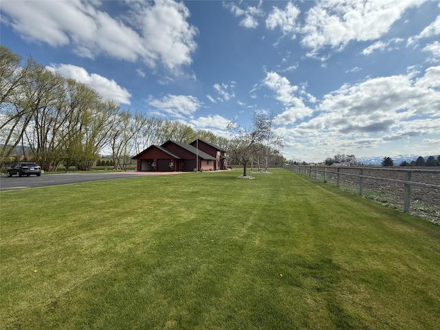 297 Christofferson Ln, Corvallis, MT 59828 - view of yard featuring asphalt driveway and a rural view