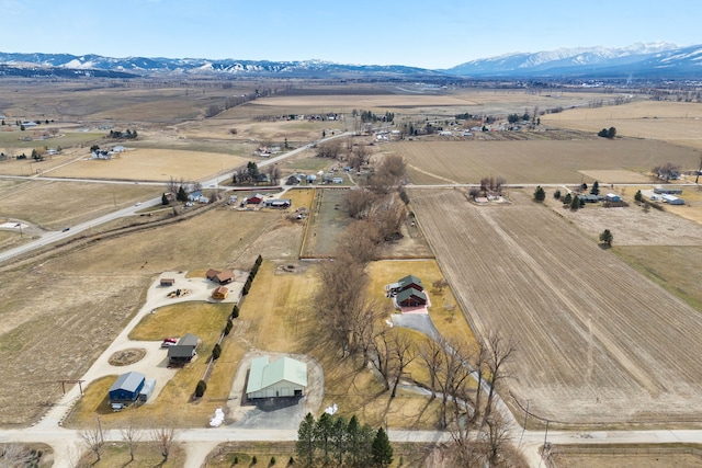 birds eye view of property featuring a mountain view and a rural view