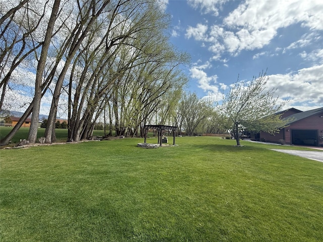 surrounding community featuring a lawn and a garage