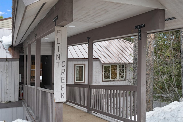 view of side of property featuring metal roof