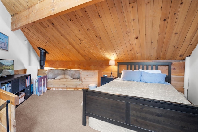 bedroom with lofted ceiling with beams, wooden ceiling, wooden walls, and carpet flooring