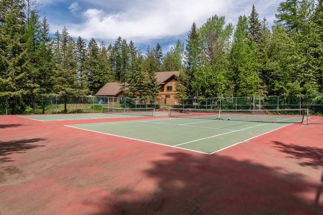 view of tennis court with fence