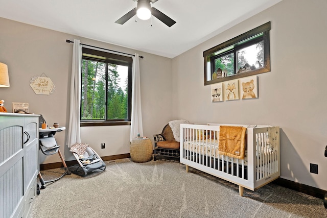 bedroom featuring ceiling fan, carpet floors, and baseboards