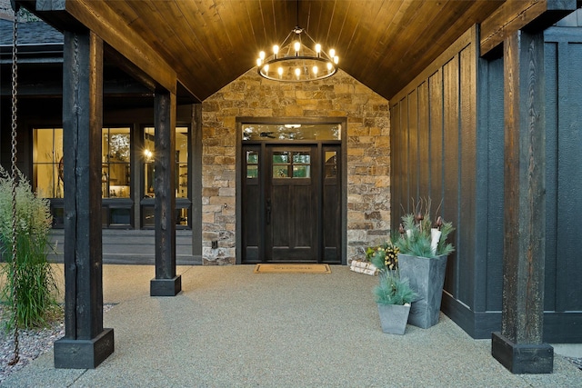 entrance to property featuring stone siding