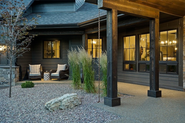 exterior space featuring a shingled roof