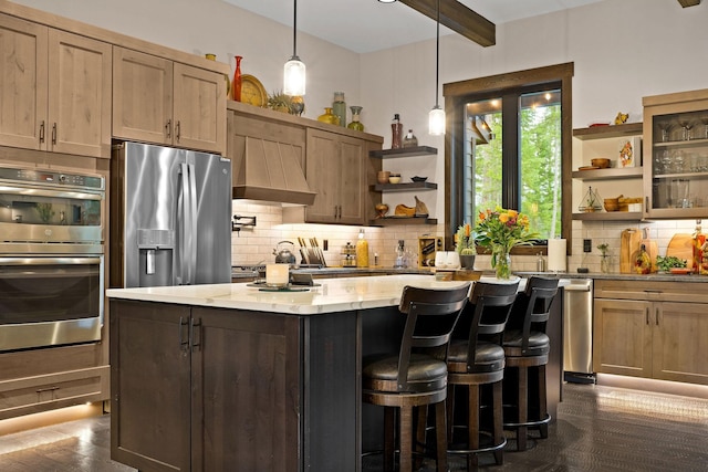 kitchen with decorative backsplash, custom range hood, appliances with stainless steel finishes, a center island, and open shelves