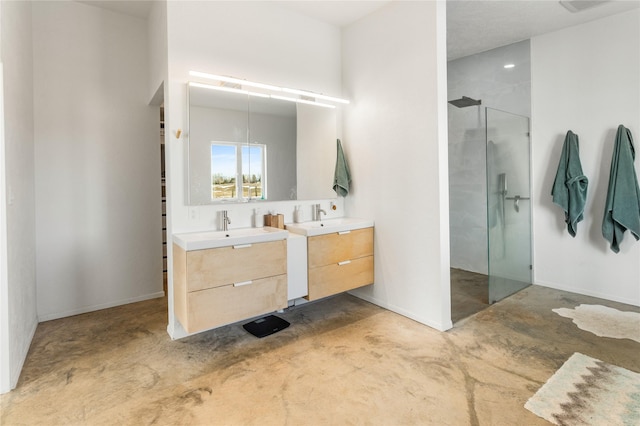 full bath with a stall shower, two vanities, unfinished concrete flooring, and a sink