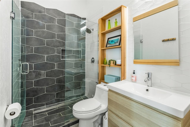 bathroom featuring a stall shower, vanity, toilet, and decorative backsplash