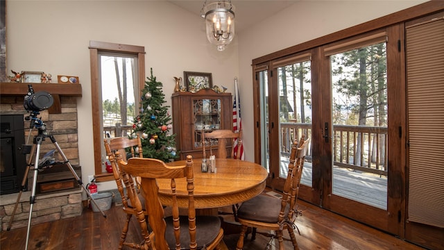 dining space with an inviting chandelier and wood finished floors