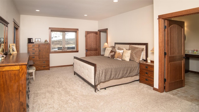 carpeted bedroom featuring recessed lighting and baseboards