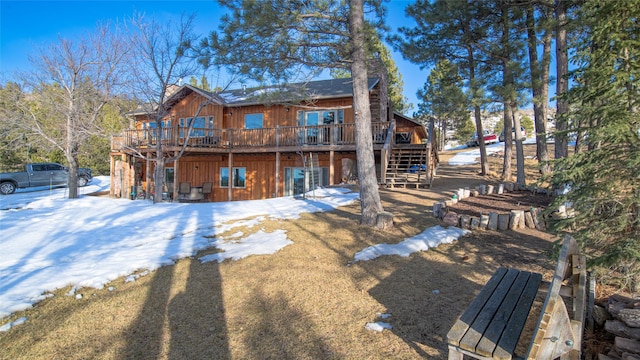 back of property with stairway and a wooden deck