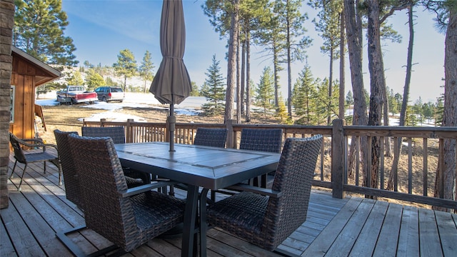 wooden deck with outdoor dining space