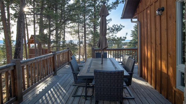 deck with outdoor dining area