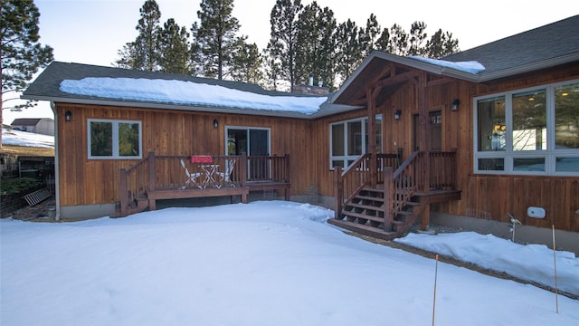 view of front of property with roof with shingles