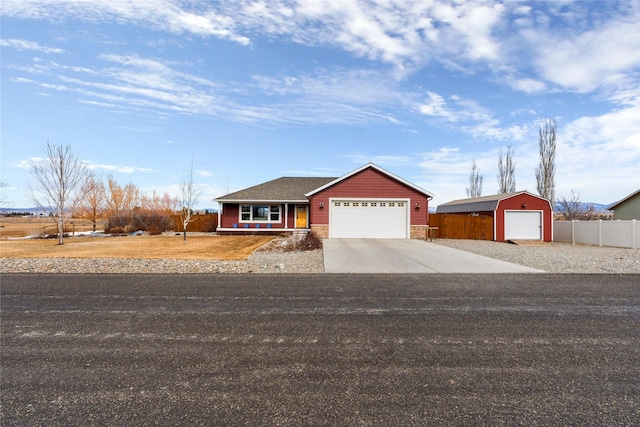 view of front of property with stone siding and fence