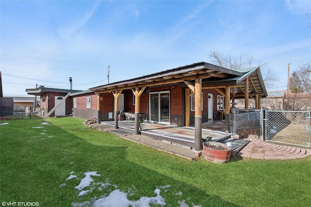 exterior space with a patio area, fence, metal roof, and a yard