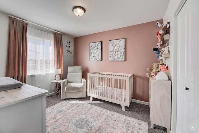 carpeted bedroom with baseboards