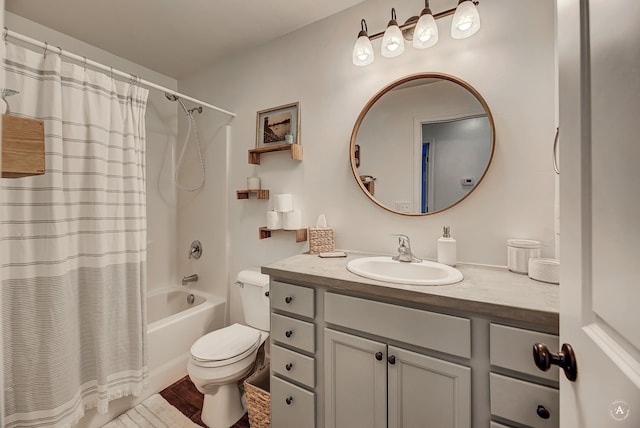 bathroom with shower / bath combo, vanity, toilet, and wood finished floors