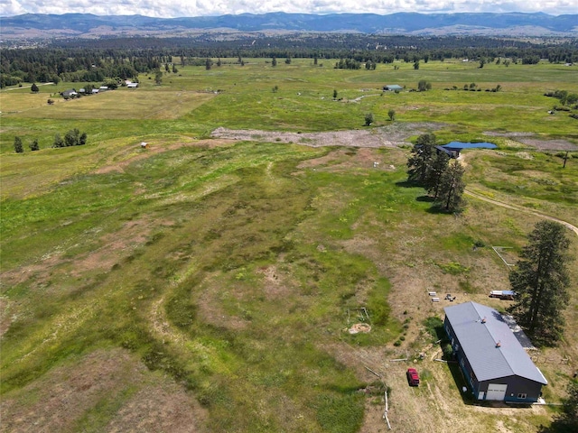 drone / aerial view with a rural view and a mountain view