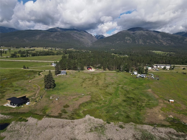 birds eye view of property with a rural view and a mountain view