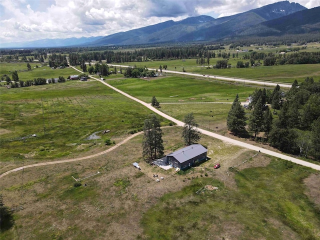 bird's eye view featuring a rural view and a mountain view