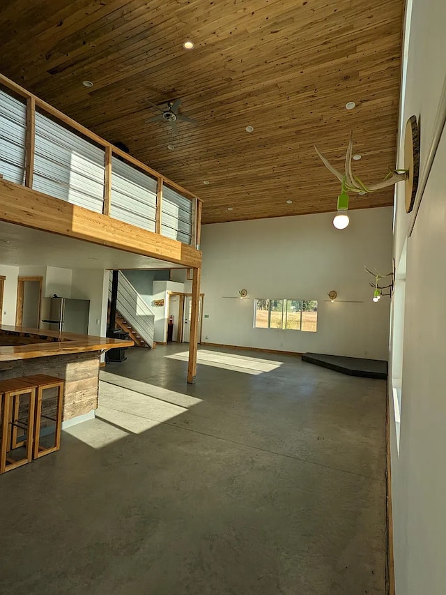 5072 Hoblitt Ln N 5066, Florence, MT 59833 - kitchen featuring wood counters, black electric range oven, freestanding refrigerator, concrete flooring, and recessed lighting