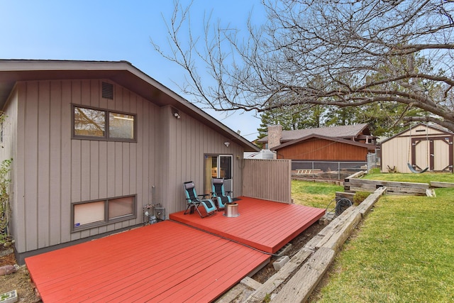325 28th Ave NW, Great Falls, MT 59404 - wooden deck with a storage shed, fence, an outbuilding, and a yard