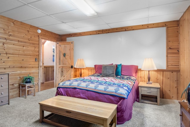 437 Tie Chute Ln, Florence, MT 59833 - carpeted bedroom with wood walls and a paneled ceiling