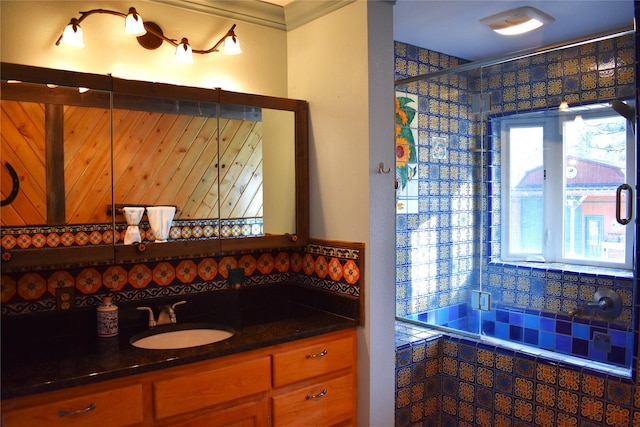 bathroom featuring a stall shower and vanity